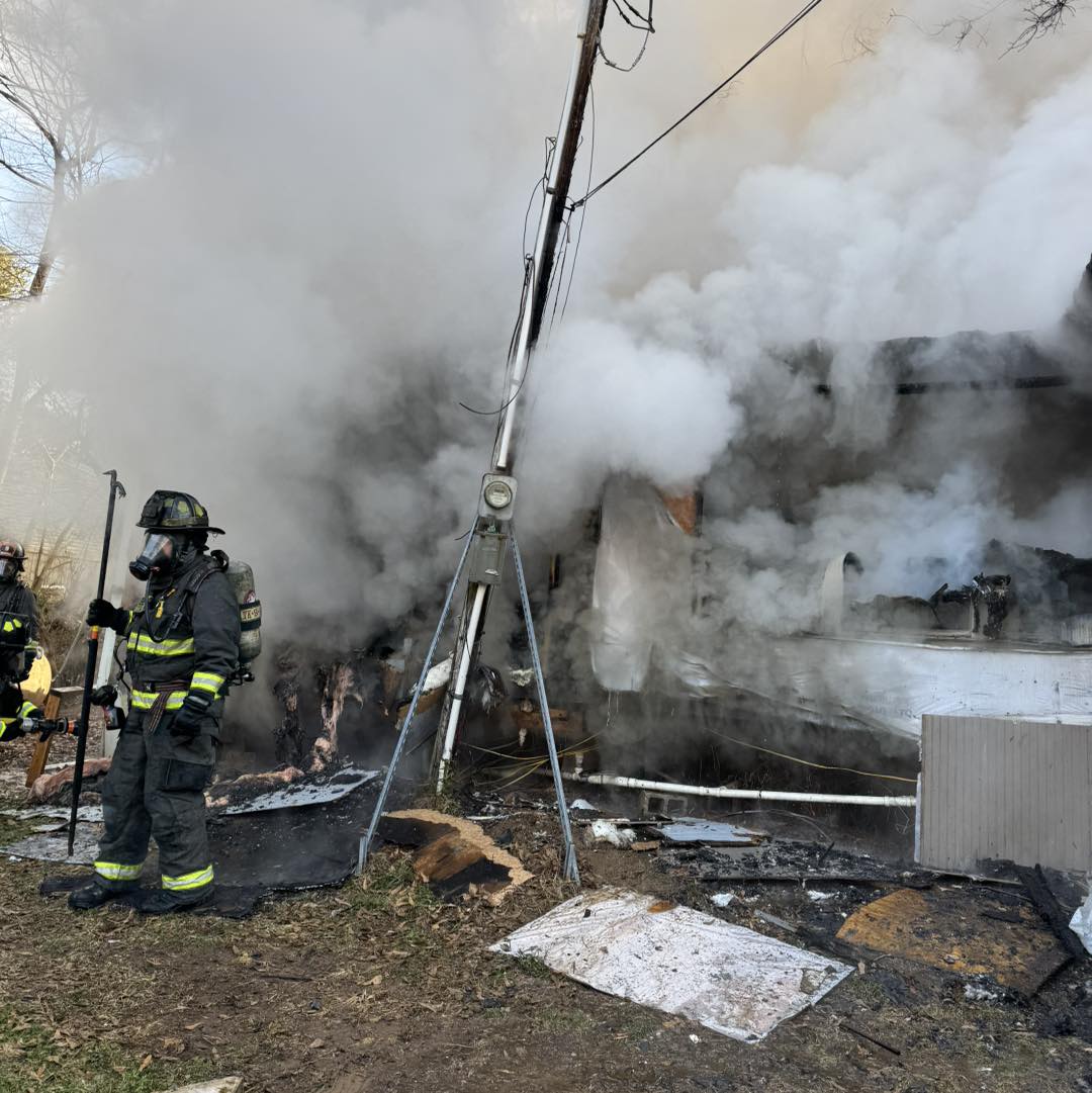 Firefighters work at the scene of a structure fire