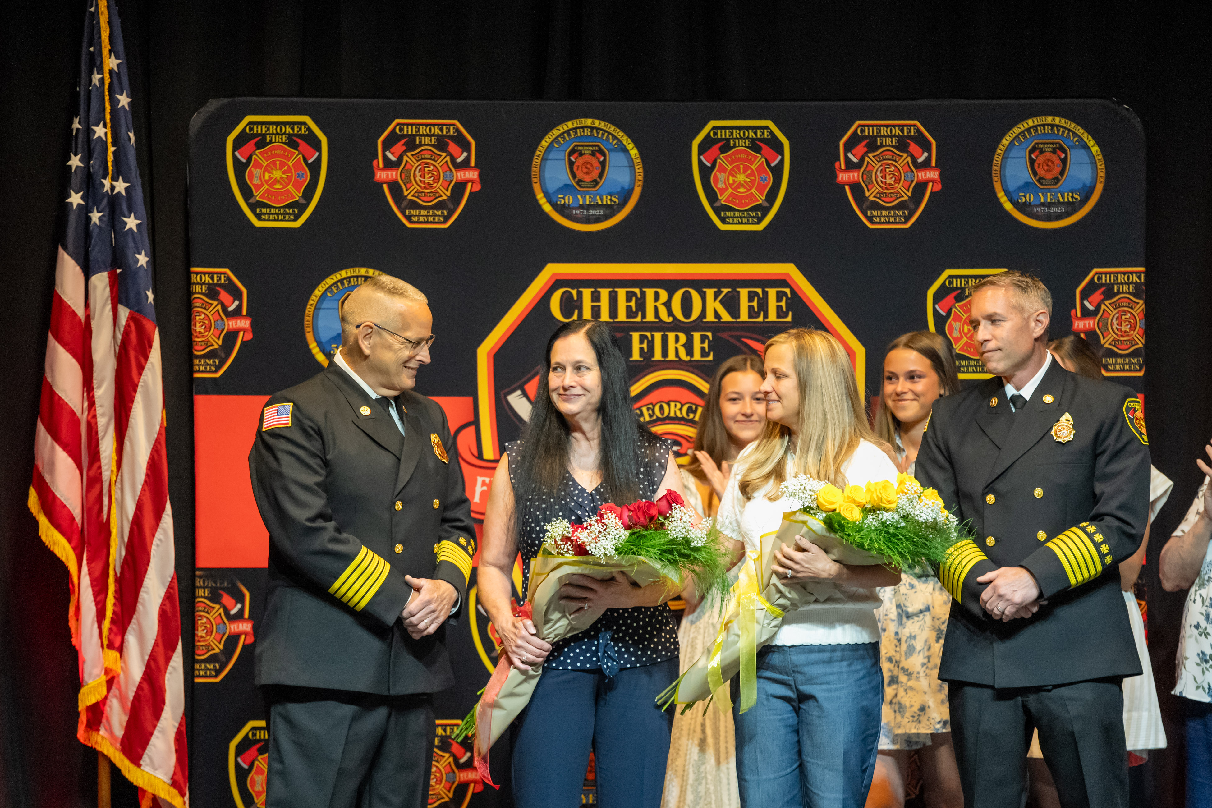 Flowers are presented to the wives of Chief Robinson and Chief Lanier. 
